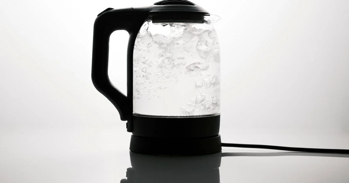 A glass electric kettle boiling water on its base, the one job every affordable electric kettle has to do