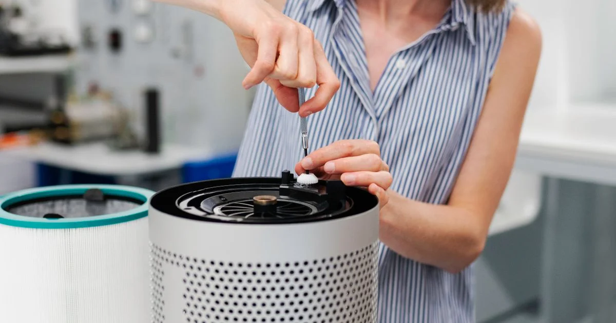 A cylindrical air purifier with a HEPA filter cartridge visible, an example of the best air purifier for allergies