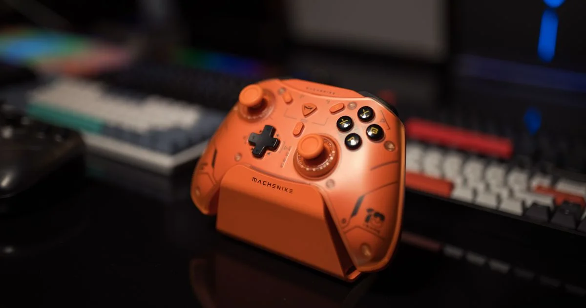Budget gaming controller for PC sitting on a charging dock next to a mechanical keyboard