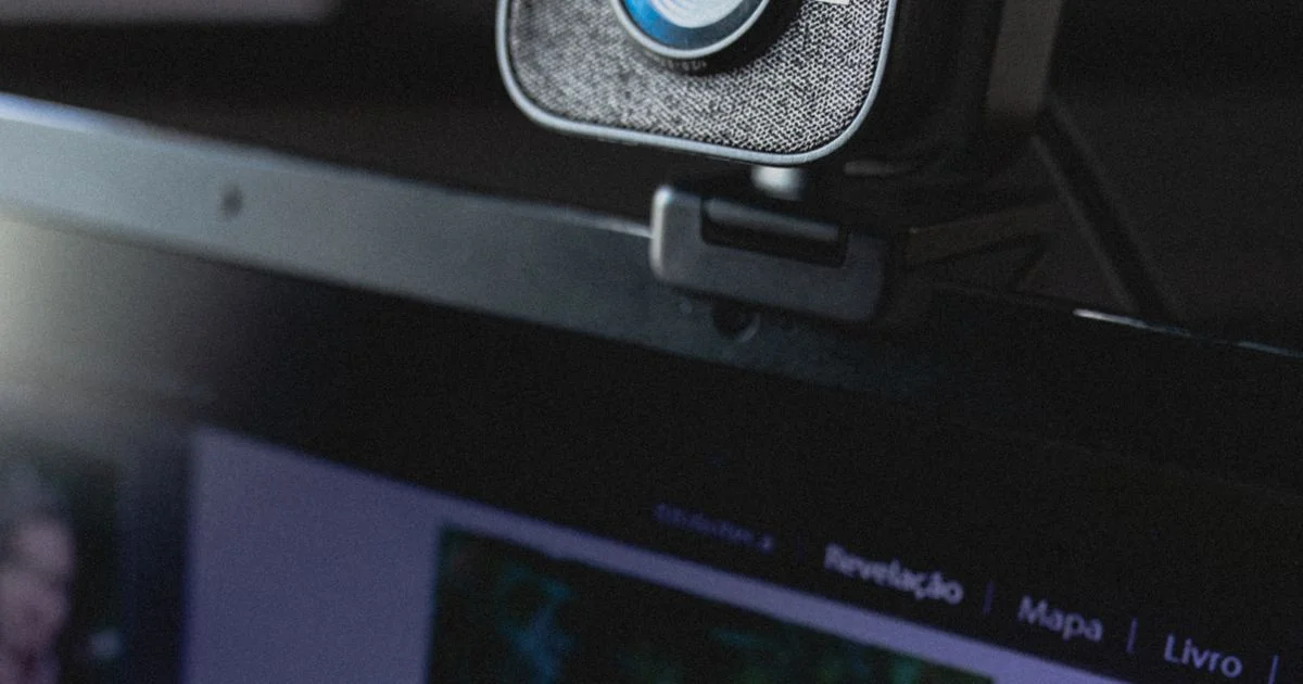 Choosing the best webcam for streaming and video calls, clipped to a laptop lid