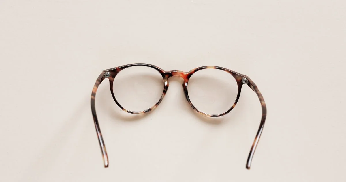 Round tortoiseshell frames with clear lenses on a plain background, the frame-versus-lens question behind is eyeglasses online worth it