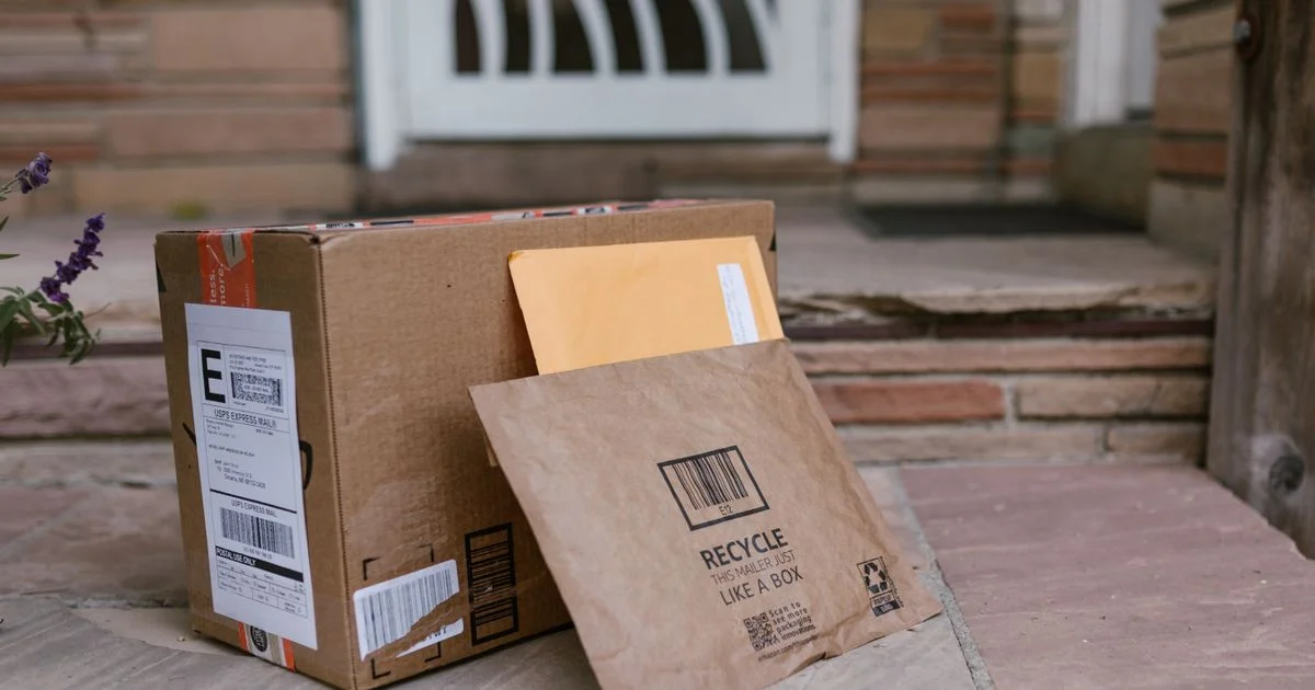 A delivered parcel and padded mailer on a front step, where the return window starts when you ask is Walmart air fryer worth it