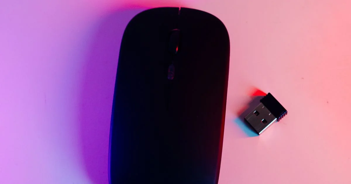 Is wireless mouse worth it? A slim unbranded wireless mouse beside its nano USB receiver